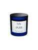 A blue candle jar labeled "Ciel Rose BDK Parfums Paris - Montmartre" with notes of fresh rose, amber, and saffron accord.