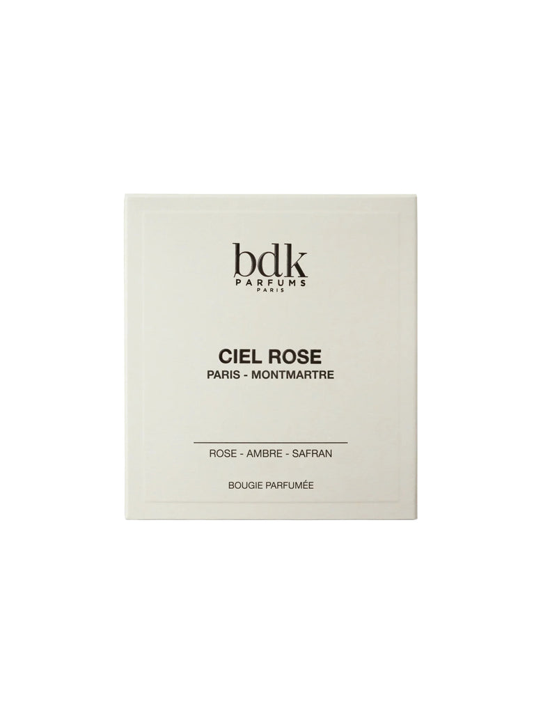 White box of BDK Parfums with black text reading "Ciel Rose by BDK Parfums. Paris - Montmartre. Fresh rose - Ambre - Safran accord. Bougie Parfumée".