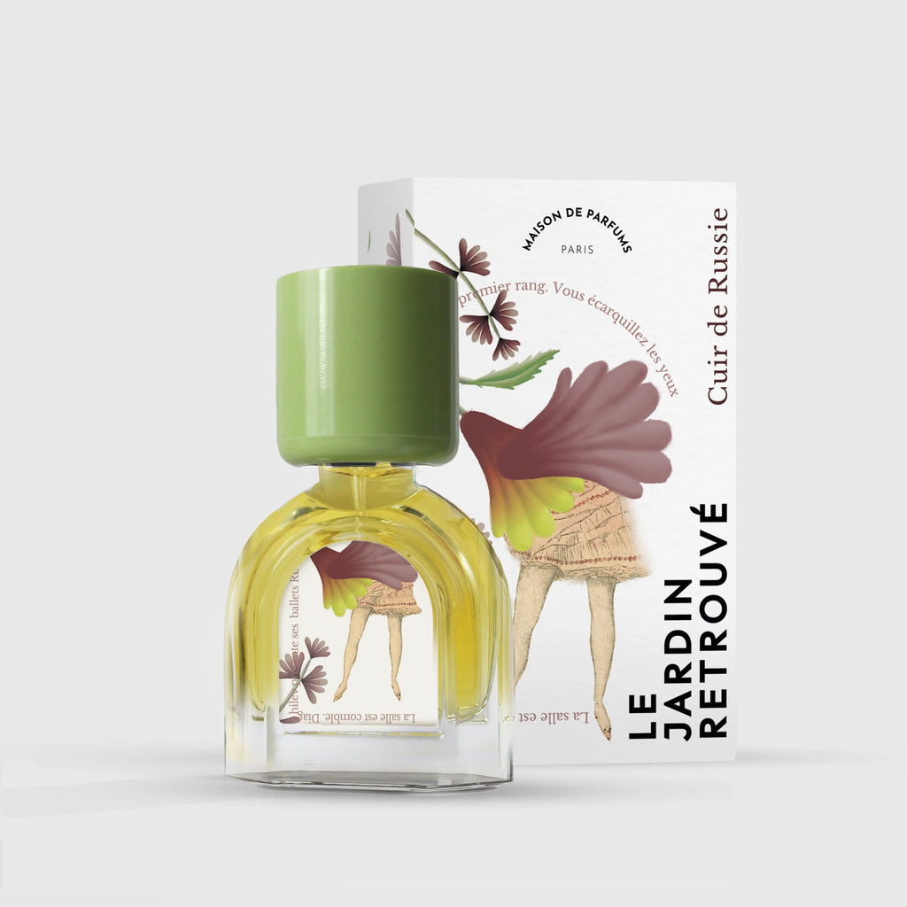 A perfume bottle with a green cap stands in front of a box labeled "Le Jardin Retrouvé Cuir de Russie." The box depicts a woman with a bird's head, wearing an elegant green and brown dress with a fan. This exquisite Eau de Parfum, named Cuir de Russie by Le Jardin Retrouvé, captures the essence of refined Russian Leather.