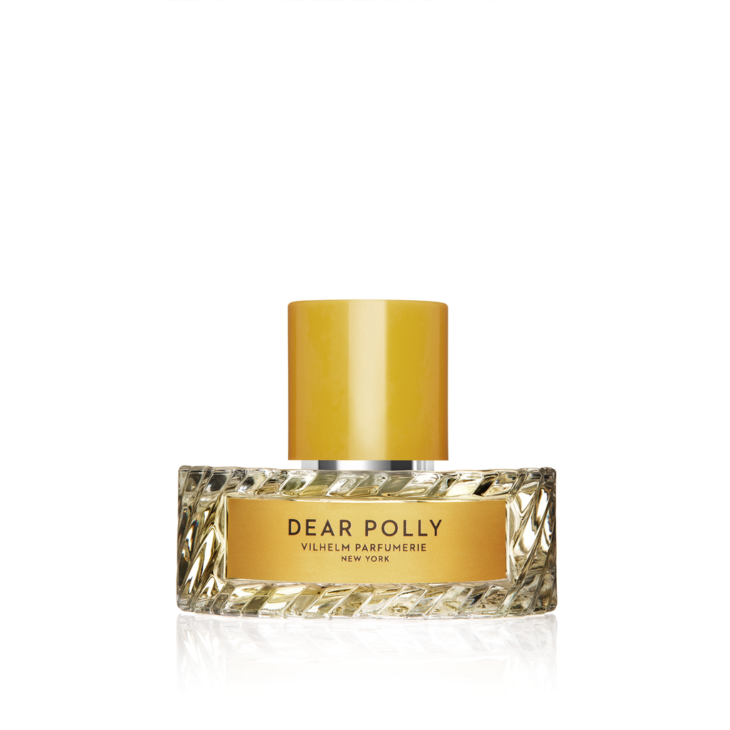 A perfume bottle labeled "Mango Skin," produced by Vilhelm Parfumerie, New York. The bottle has a textured base and a golden cap, evoking the rich depth of patchouli and the fruity allure of blackberries.