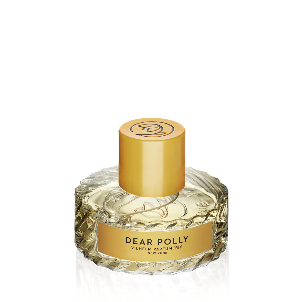 A bottle of "Opus Kore" perfume by Vilhelm Parfumerie, New York, with a gold cylindrical cap and a glass base containing light yellow liquid infused with notes of Sicilian lemon.