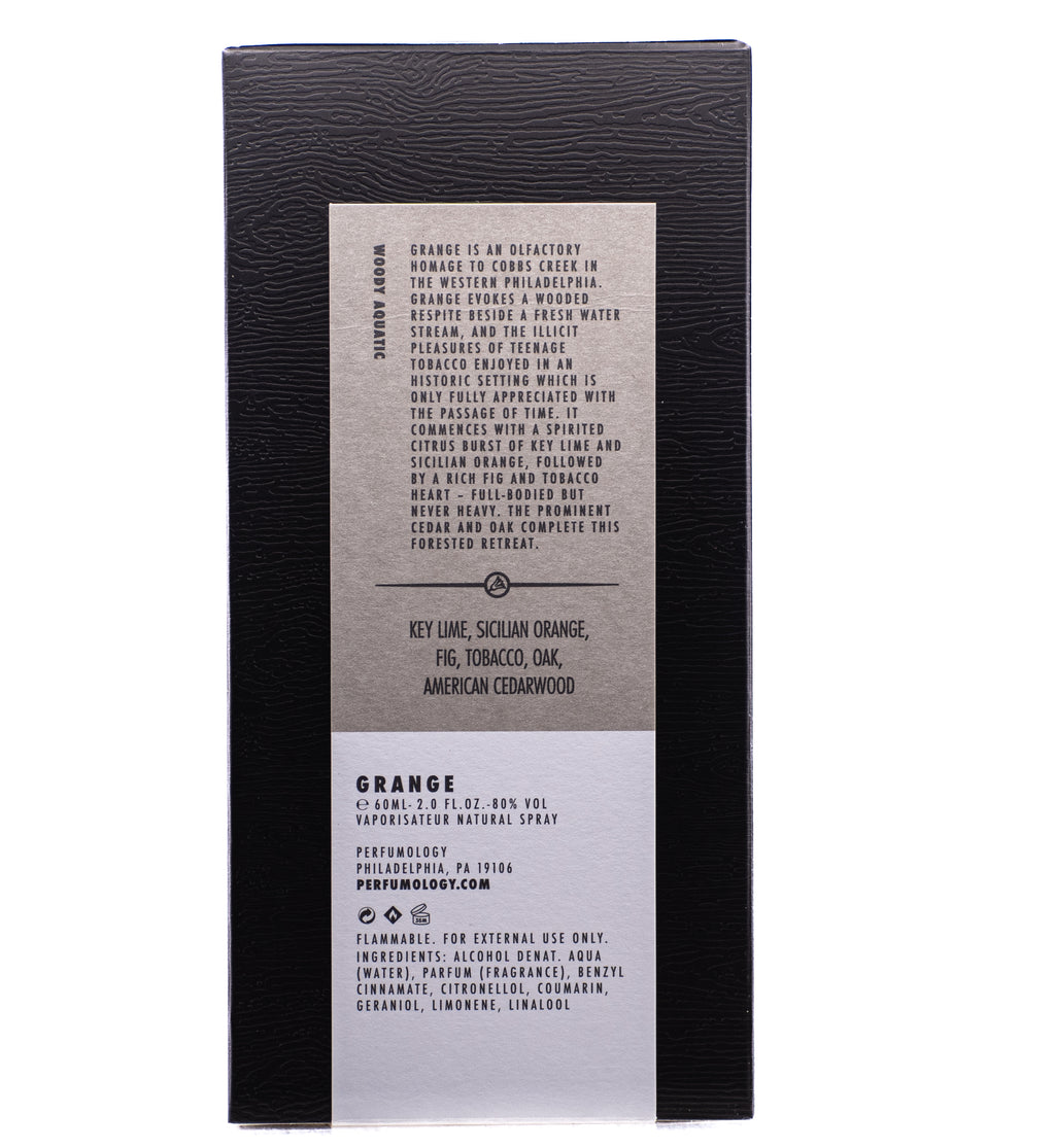 Black and beige Perfumology Grange packaging with detailed product information and a fragrance note list, including key lime, Sicilian orange, fig, tobacco, oak, and American cedarwood—nostalgic to a moment in the woods during my childhood.