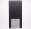 A black box with embossed text "Perfumology." A smaller, white label on the front reads "Clutch, 60ML/2FL.OZ." This independent perfume offers an exhilarating scent, featuring a sophisticated leather fragrance.