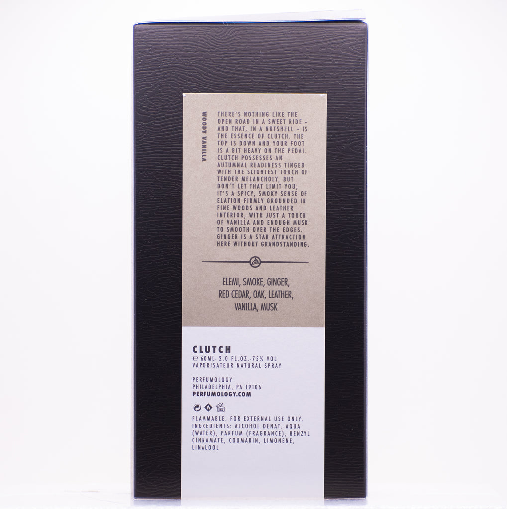 A dark box with a centered label lists fragrance notes including elemi, smoke, ginger, red cedar, vanilla, musk, and more. Additional text provides details about the exhilarating scent and origin of Perfumology's Clutch perfume.