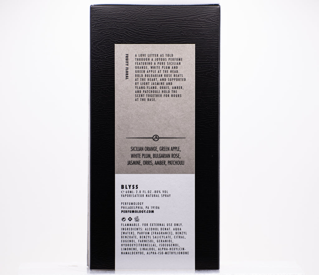 The back of a perfume box showcasing "Blyss" with an ingredients list, fragrance notes, usage instructions, and the product's sizing information (6 fl. oz./185 mL). The Blyss fragrance, crafted through Perfumology using high quality ingredients, promises a sublime olfactory experience.