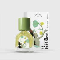 A perfume bottle with a green cap and floral design on the front. Behind the bottle is its packaging featuring similar floral artwork and the text "Le Jardin Retrouvé Eau des Délices." This unisex scent, Eau des Délices, captures an Eau Fraiche vibe, blending fresh florals with a hint of citrus.