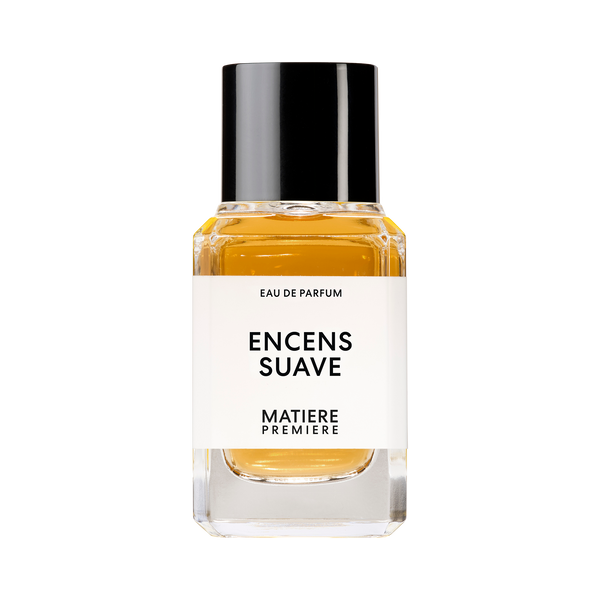 A bottle of Eau de Parfum named "ENCENS SUAVE" by Matiere Premiere, containing amber-colored liquid infused with Labdanum Absolute and featuring a black cap.