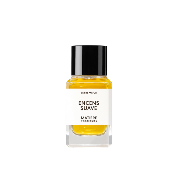 The "ENCENS SUAVE" Eau de Parfum by Matiere Premiere comes in a bottle with a black cap and features yellow liquid inside. It has a white label on the front, and the fragrance is enriched with notes of Resin Incense that add depth to its aromatic profile.