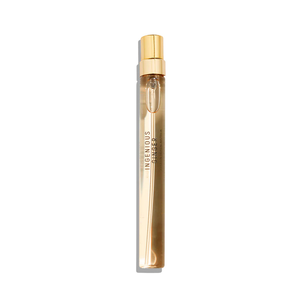 A slender, transparent perfume bottle with a gold cap, labeled "Ingenious Ginger," evokes the essence of tropical elegance with hints of ginger. Produced by Goldfield & Banks