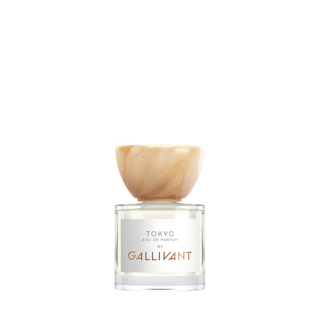 A clear bottle of Tokyo by Gallivant from Gallivant Perfumes, featuring a beige cap and offering a zingy spicy woody fragrance.