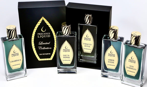 Image of five bottles of Precious Liquid Iris Sorbet Eau de Parfum Limited Collection in different fragrances: Champaca, Salt & Pepper, Tobacco Royal, Amber Suede, and Oud Symphony, each promising creamy sandalwood notes and impressive lasting power. Displayed elegantly with their boxes.