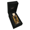 A bottle of Ambrosia Imperiale by Navitus Parfums, with a hint of Ambrosia Imperiale, lays in an open black box with a gold cap and black label.