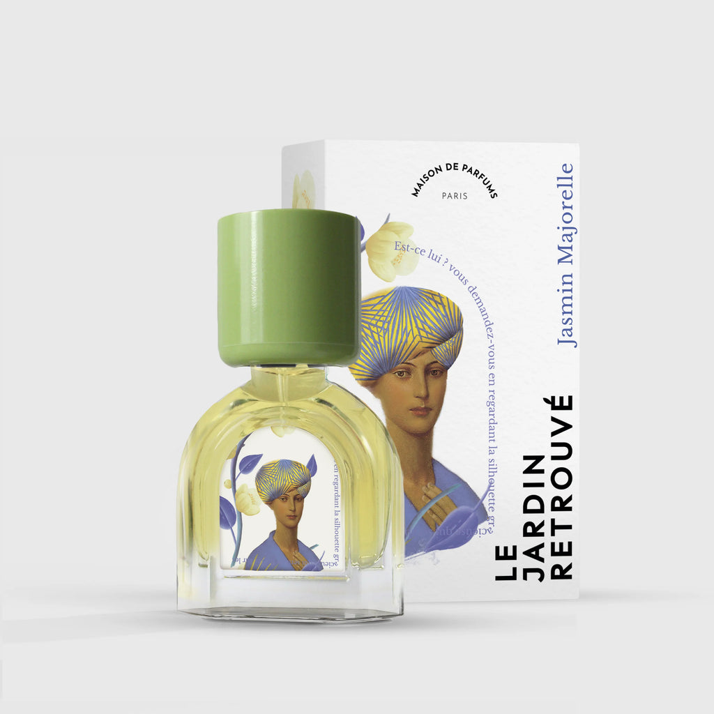 A Le Jardin Retrouvé bottle labeled "Jasmin Majorelle" with an illustration of a woman's face on the label and its matching box in the background.