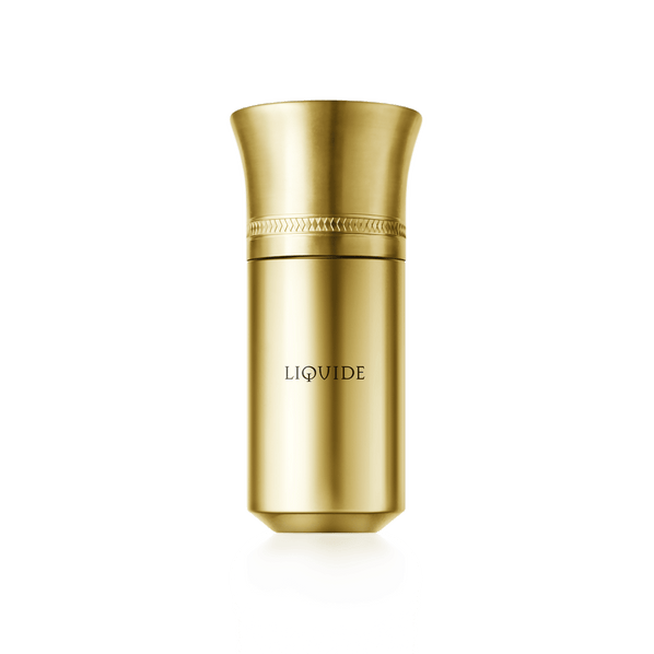 A gold cylindrical perfume bottle, featuring the words "LIQUIDE GOLD" from Liquides Imaginaires, adorned with an ornate design near the top that embodies a metallic spirit.