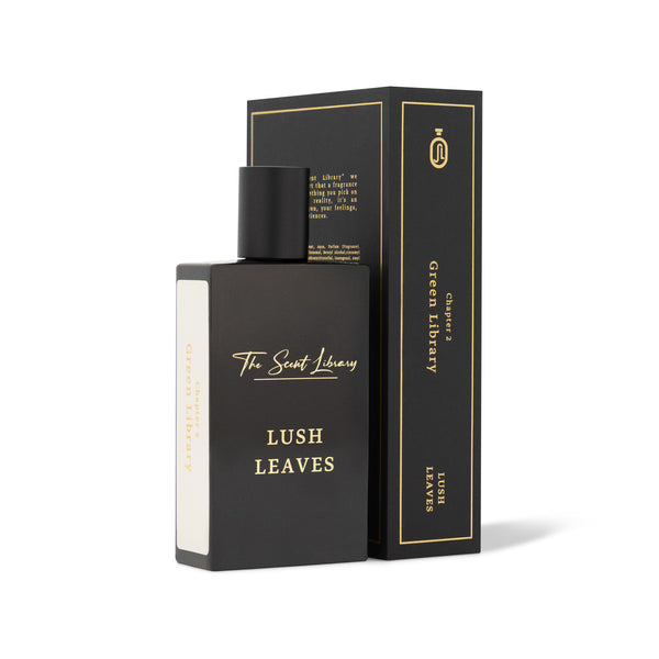 A black perfume bottle labeled "Lush Leaves" is showcased next to a coordinating black box adorned with gold accents. The box, branded with "The Scent Library," includes additional text detailing the fragrance's rejuvenating scent.