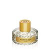 A clear glass bottle of Mango Skin by Vilhelm Parfumerie, with a yellow cap and label, hints at tropical elegance, combining succulent mango and subtle patchouli.