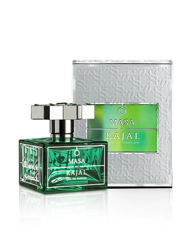A green bottle of Masa By Kajal from the Kajal - Classic Collection is displayed next to its metallic-textured packaging box. The bottle, resembling the resilience of a diamond, has a silver cap and a green label with white text.
