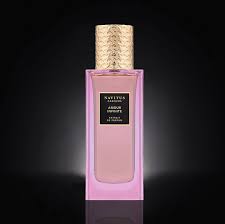 A luxurious blend, the rectangular pink perfume bottle with a textured gold cap is centered against a dark background. The label reads "Amour Infinite by Navitus Parfums.