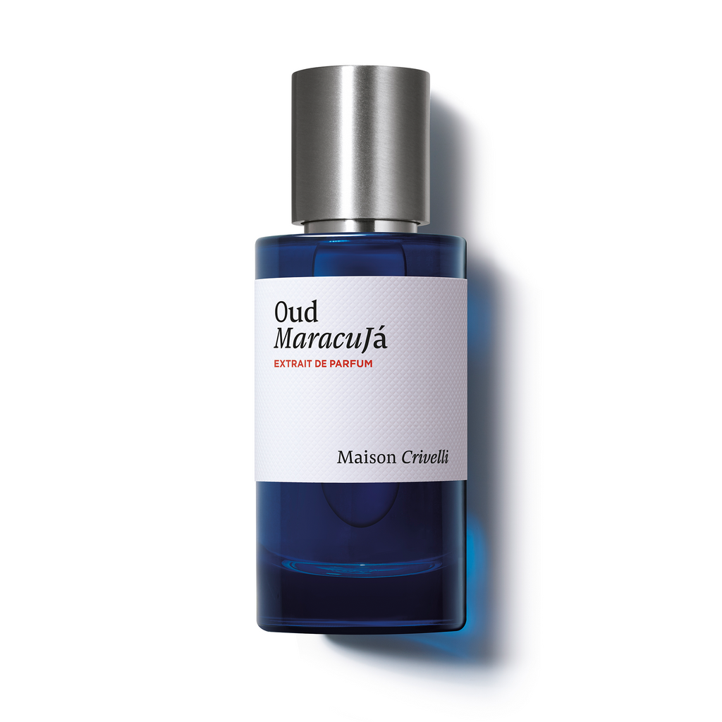 A blue perfume bottle with a silver cap and a white label reading "Oud Maracuja, Maison Crivelli," this fragrance combines the rich depth of oud wood with a tantalizing passion fruit accord.