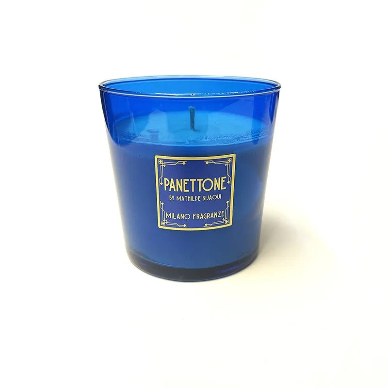 A blue candle in a glass container labeled "Panettone Candle by Milano Fragranze," offering a delightful Panettone fragrance.