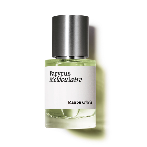A bottle of "Papyrus Moléculaire" by Maison Crivelli features clear glass and a silver cap, containing a greenish liquid infused with papyrus essential oil.