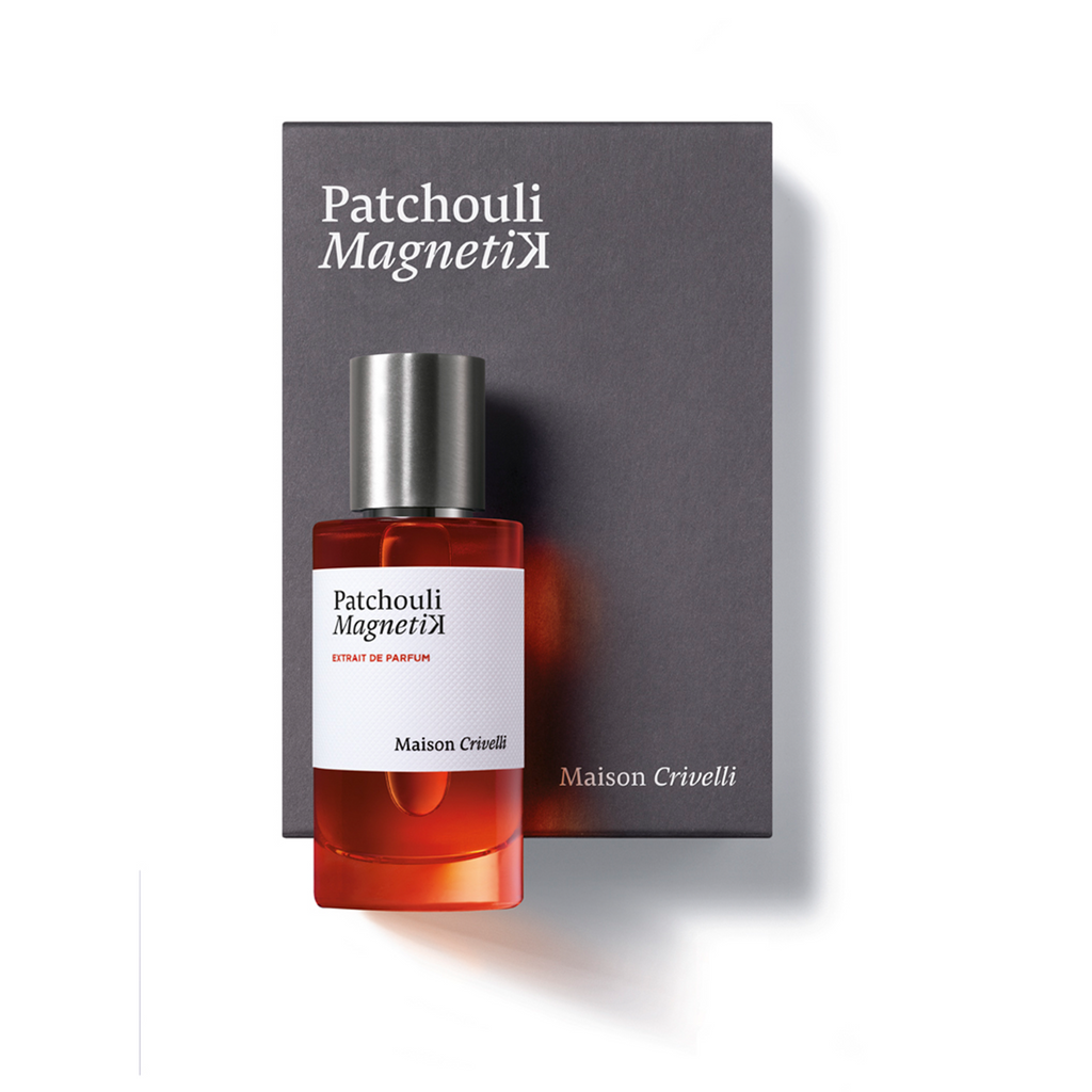 A bottle of Patchouli Magnetik by Maison Crivelli, a mesmerizing woody solar fragrance, gracefully resting atop its sophisticated black box packaging.