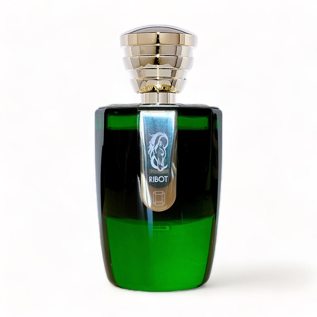 The Ribot Extrait de Parfum by Masque Milano comes in a green glass bottle featuring a silver cap with multiple ridged layers. The label displays a graphical logo along with the brand name 'Masque Milano' and the word 'Ribot.' This exquisite fragrance was created by Antoine Lie.