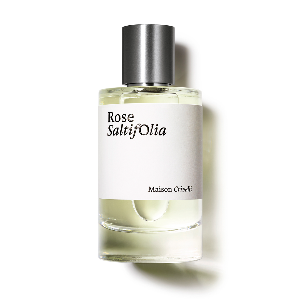 A bottle of Rose Saltifolia by Maison Crivelli, adorned with a simple white label and silver cap, elegantly combines floral marine notes with the essence of rose Centifolia.