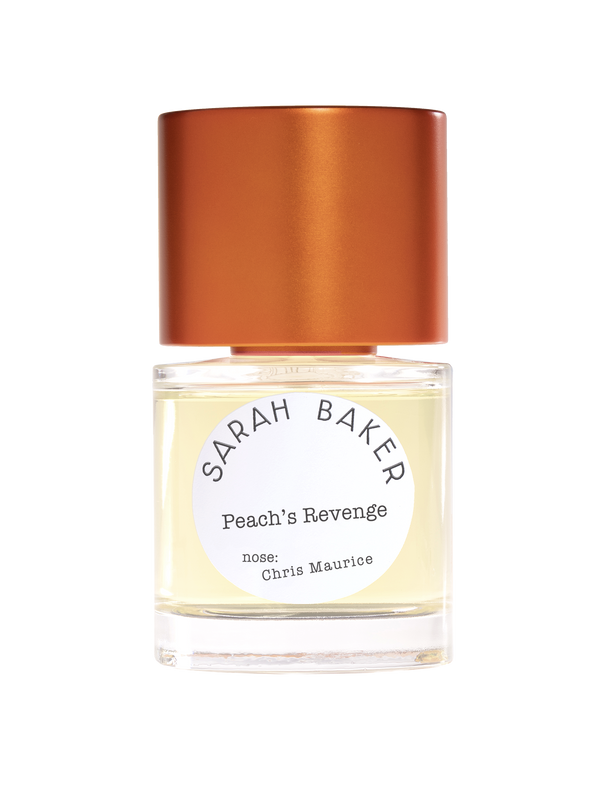 A bottle of "Peach's Revenge" perfume by Sarah Baker, distinguished by an orange cap. The label reveals that the nose behind this enchanting fragrance is Chris Maurice. This delightful and memorable scent features hints of juicy peach.