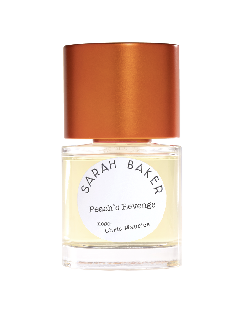 A bottle of "Peach's Revenge" perfume by Sarah Baker, distinguished by an orange cap. The label reveals that the nose behind this enchanting fragrance is Chris Maurice. This delightful and memorable scent features hints of juicy peach.