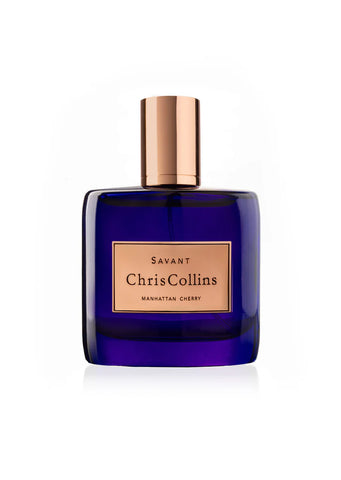 Dark blue perfume bottle with gold cap and Savant label