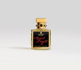 A square, transparent perfume bottle with a gold cap labeled "Secret Tryst" by Fragrance Du Bois, set against a light gray background.