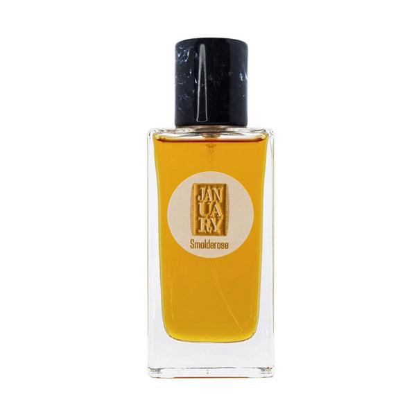 Smolderose perfume bottle with clear glass, black cap, and amber-yellow liquid