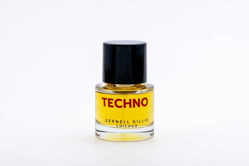 A small bottle of yellow liquid labeled "TECHNO" by Zernell Gillie from Chicago, featuring a black cap. This unisex fragrance is the signature scent that perfectly captures the essence of electronic music.
