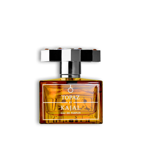 Amber Eau de Parfum bottle with silver cap and gold label reading Topaz