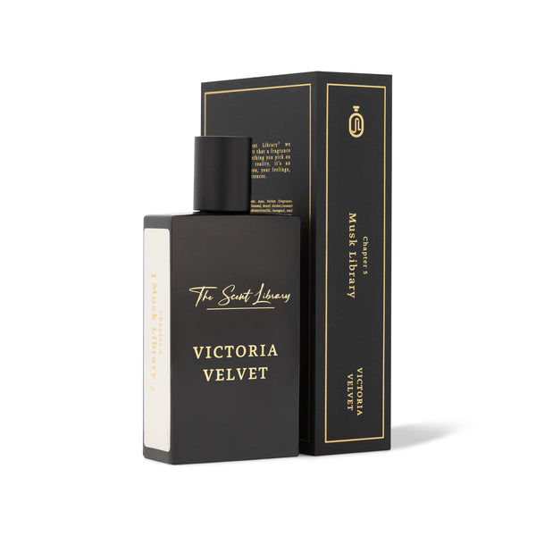 A black perfume bottle labeled "Victoria Velvet," exuding an air of royal allure, stands next to its matching box from The Scent Library.