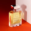 A bottle of Ormonde Jayne Vanille des Afriques Intensivo perfume with a silver cap, featuring Madagascan vanilla absolute, placed on a red surface against a white wall.