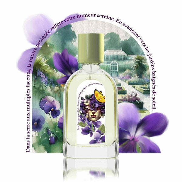 A perfume bottle with a floral design sits in front of an illustrated garden scene adorned with flowers and French text above. The Eau de Parfum, Violette Kew by Le Jardin Retrouvé, is a unisex fragrance that captures the essence of blooming gardens.