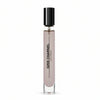 A clear cylindrical glass bottle with a black cap contains Gris Charnel by BDK Parfums Eau de Parfum, reminiscent of an evening stroll in the Tino-Rossi garden. The bottle has the product name and type printed vertically in black letters.