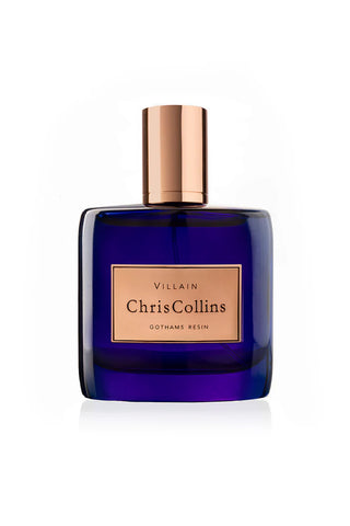 Blue perfume bottle with gold cap and label 'Chris Collins' (Gothams Resin)