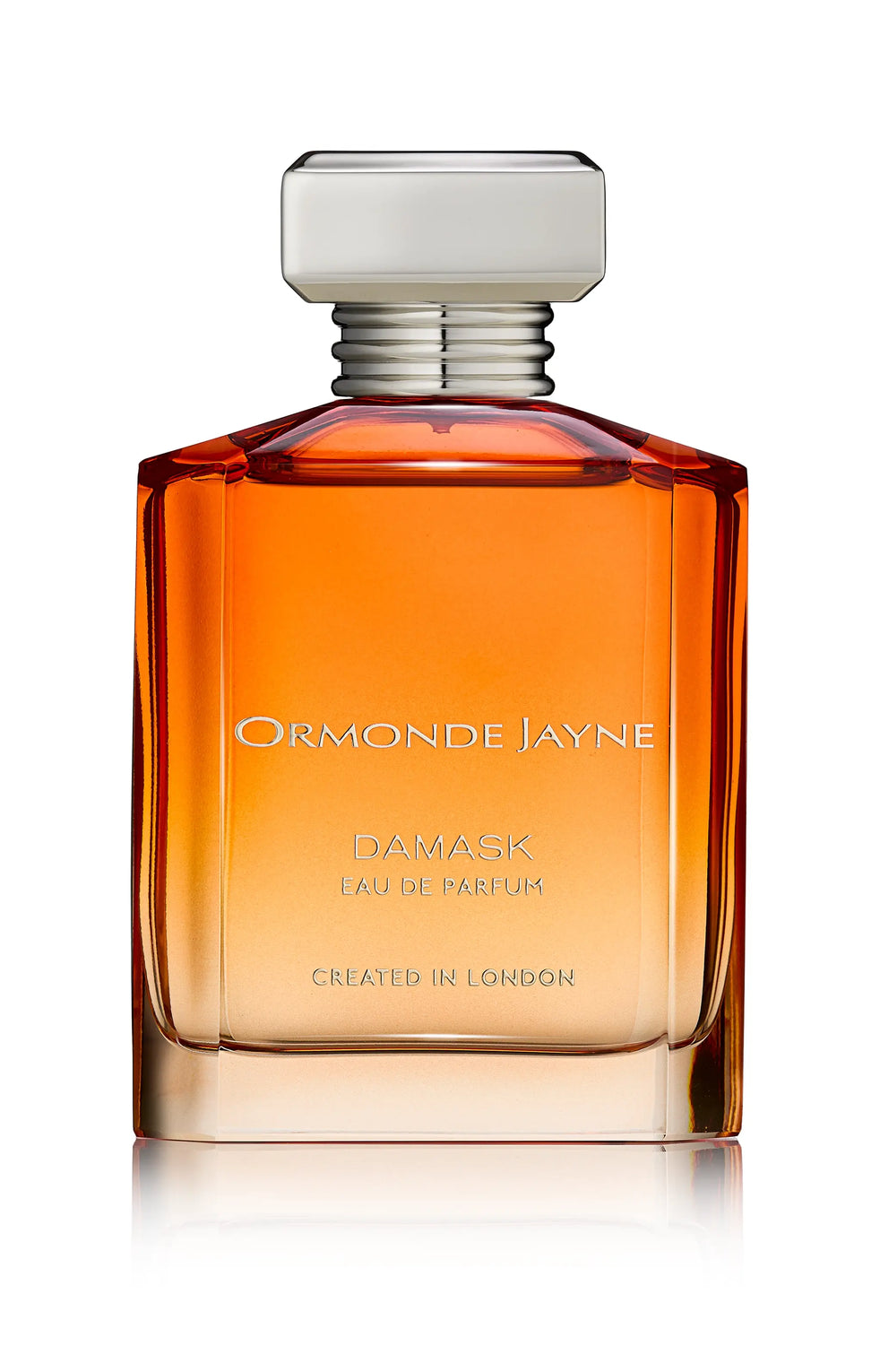 A bottle of Ormonde Jayne Damask Eau de Parfum, showcasing an amber-tinted liquid with fruity notes and adorned with a silver cap, is labeled "Created in London.