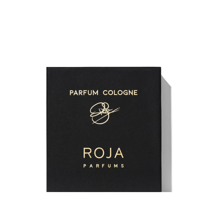 Black box with gold lettering displaying "PARFUM COLOGNE" and "ROJA PARFUMS," featuring a decorative logo in the center. The design hints at an intricate blend of Cognac and Tobacco, evoking the oriental sophistication of Enigma Pour Homme Parfum Cologne by Roja Parfums.