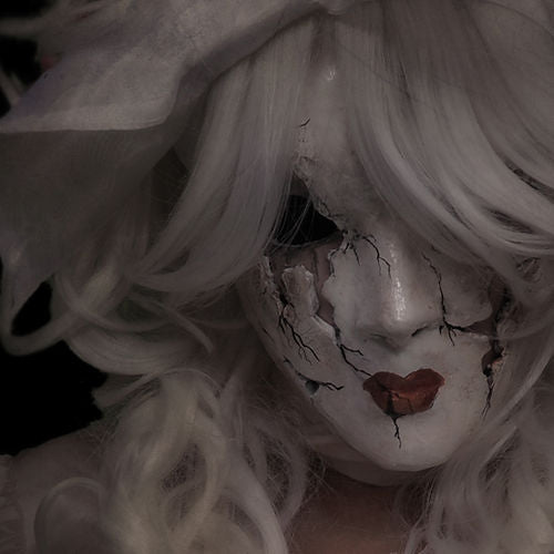 A person reminiscent of a porcelain doll is depicted in the image, featuring a cracked white mask and white hair. The makeup includes dark eye details and red lips, enhancing the haunting visage. Delicate lily of the valley flowers are woven into their hair, adding an ethereal touch that perfectly embodies Ikiryo's "I Have Brought You Flowers.