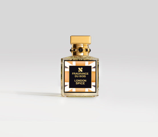 A bottle of Fragrance du Bois London Spice labeled "London Spice" with a gold cap on a white background, crafted by master perfumer Francois Merle-Baudoin. This masculine fragrance captures the essence of sophistication and style.