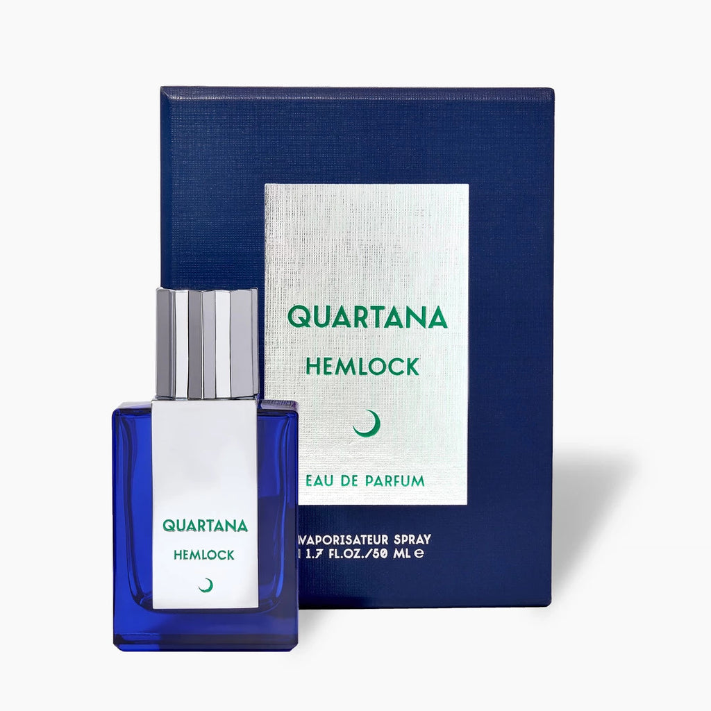 A blue rectangular perfume bottle labeled "Parfums Quartana Hemlock" stands elegantly in front of its matching box. The box reads "Hemlock Eau De Parfum 1.7 fl oz/ 50 mL" in white and green text, hinting at the mysterious fragrance within.