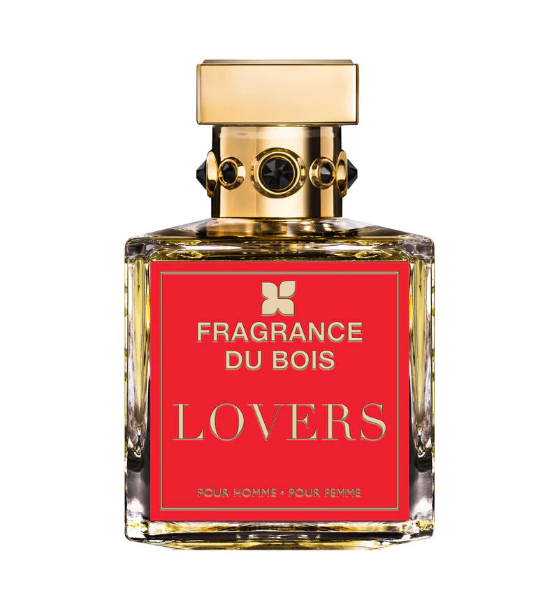 A clear glass bottle of Fragrance du Bois LOVERS Extrait De Parfum with a gold cap and a red label showcases the product name. This woody fragrance acts as an aromatic aphrodisiac, perfect for intimate moments.