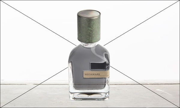 A glass bottle with a green cap and dark liquid inside, labeled "Megamare" by Orto Parisi, sitting on a wooden table against a white background, evokes the mysterious allure of an Aromatic Aquatic fragrance similar to those crafted by Alessandro Gualtieri.