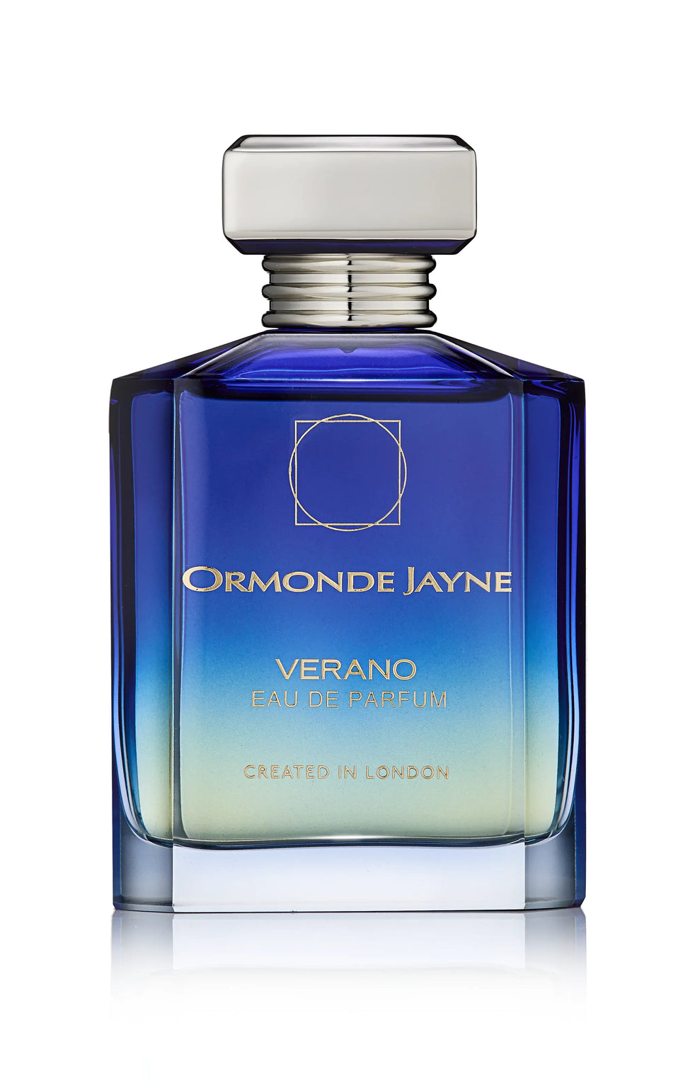 A bottle of Montabaco Verano by Ormonde Jayne with a gradient blue and gold design, rectangular shape, and a silver cap. Text on the bottle reads "VERANO Eau de Parfum Created in London." This limited edition fragrance embodies luxury and sophistication.