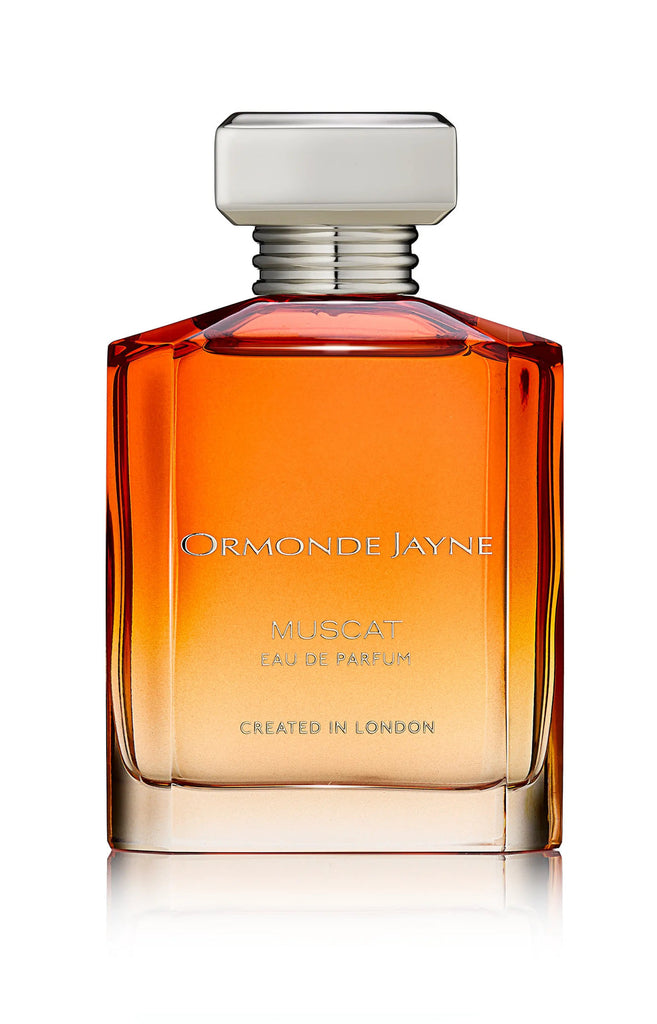 A bottle of Ormonde Jayne Muscat Eau de Parfum featuring an amberesque orange gradient design and adorned with the text "Created in London" on the front.