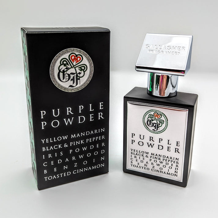 Both boxed and unboxed bottles of Gallagher Fragrances' Purple Powder perfume are available, featuring notes of yellow mandarin, black and pink pepper, iris, papyrus, cedarwood, benzoin, and toasted cinnamon. This niche fragrance exudes sophistication and allure.